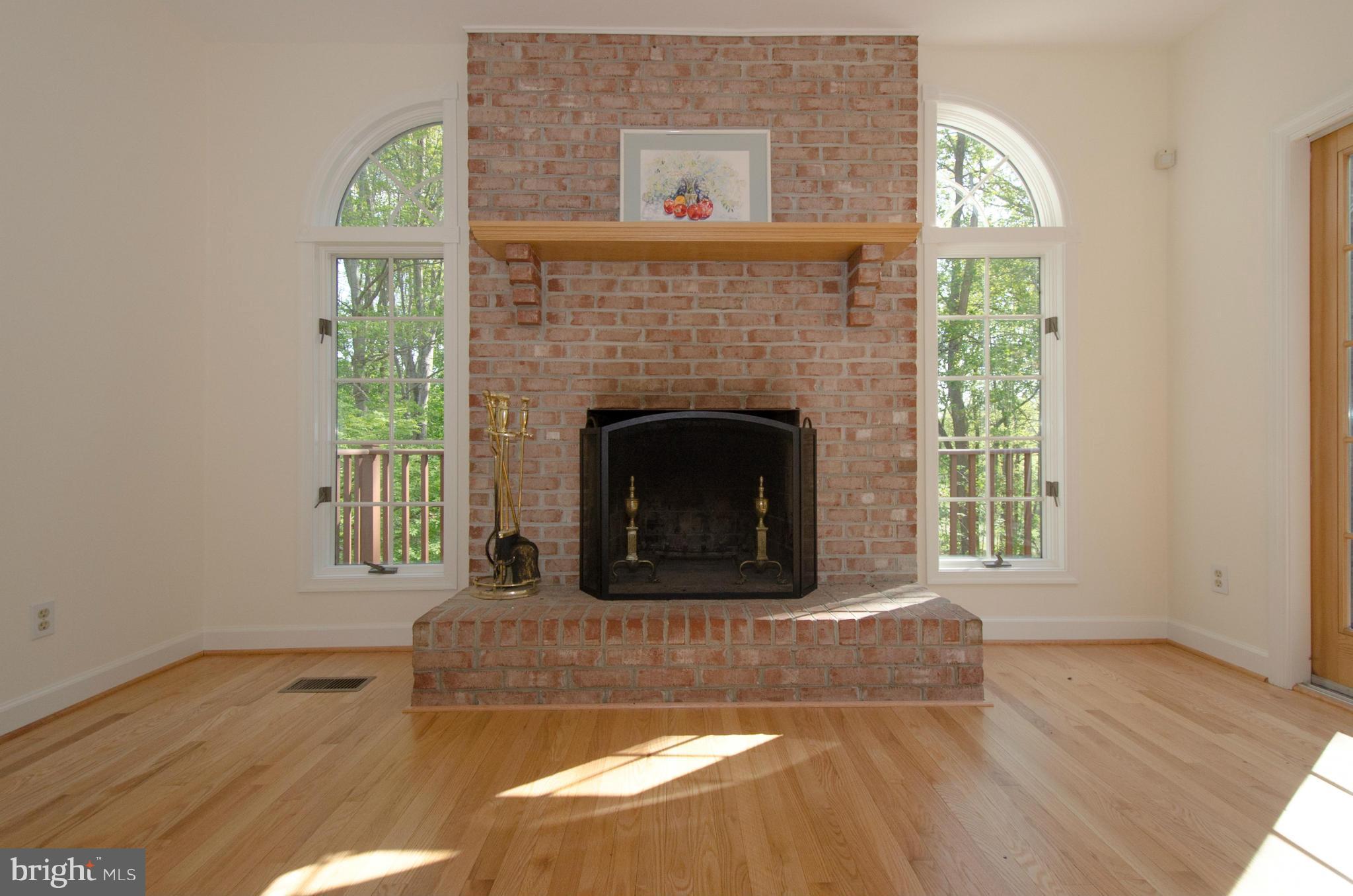 Family Room w/wd burning FP; quarter-round windows