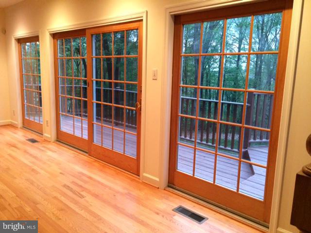 17610 Backbone Road Parkton, MD 21120 - Photo 8 of 30 Family Rm w/wall of windows; slider to cedar deck