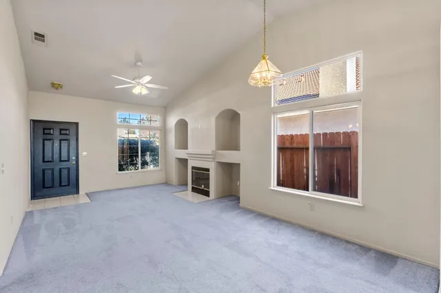 a kitchen with a stove a sink and a refrigerator