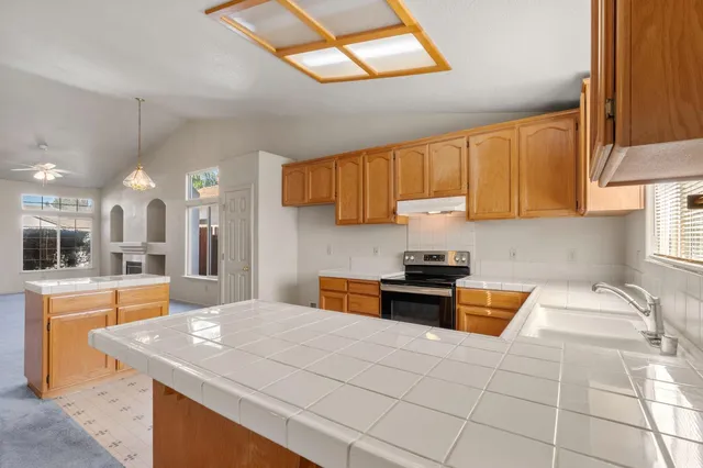 a view of a kitchen with a sink and dishwasher