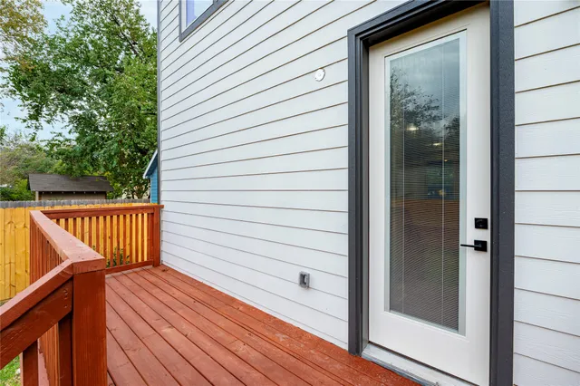 a view of balcony with wooden floor