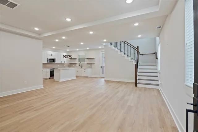 a view of kitchen and wooden floor
