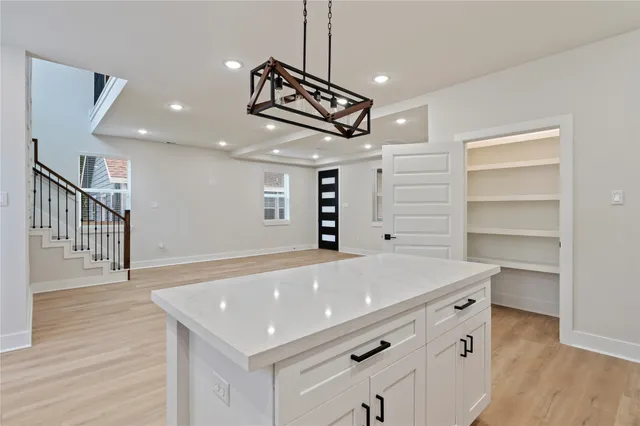 a room with cabinets and wooden floor