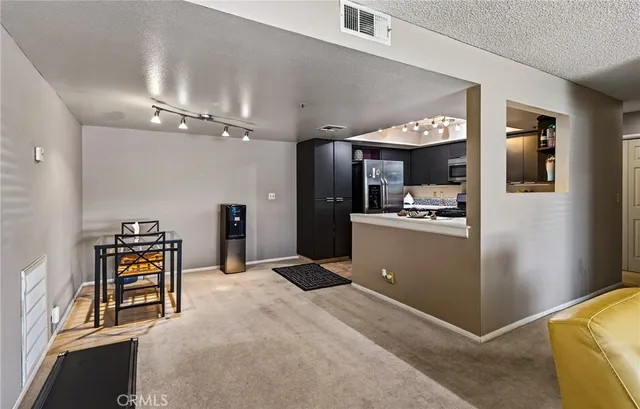 a view of a kitchen with furniture and a kitchen