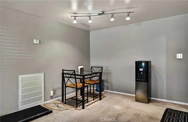 a view of a hallway with seating area