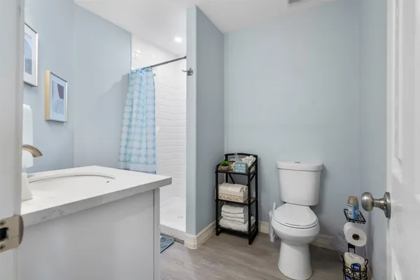 a bathroom with a toilet a sink and a bathtub