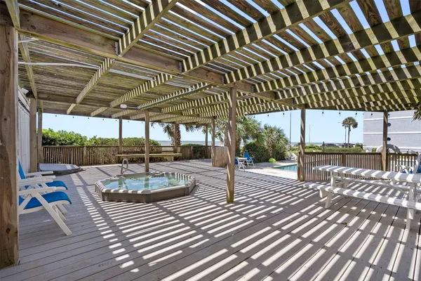 a view of a patio with wooden floor