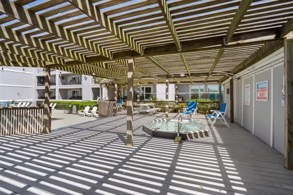a view of a patio with table and chairs with wooden floor