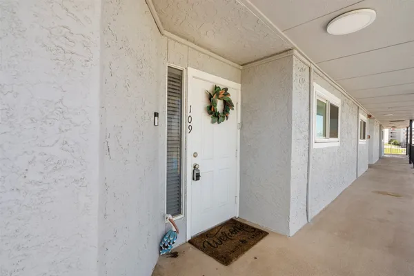 a view of a porch with wooden floor