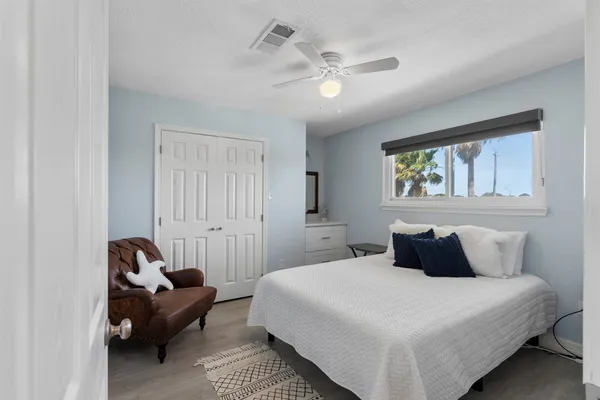 a bedroom with a bed and window