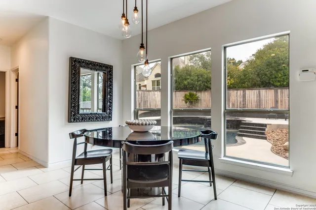 a kitchen with stainless steel appliances granite countertop a sink refrigerator and cabinets