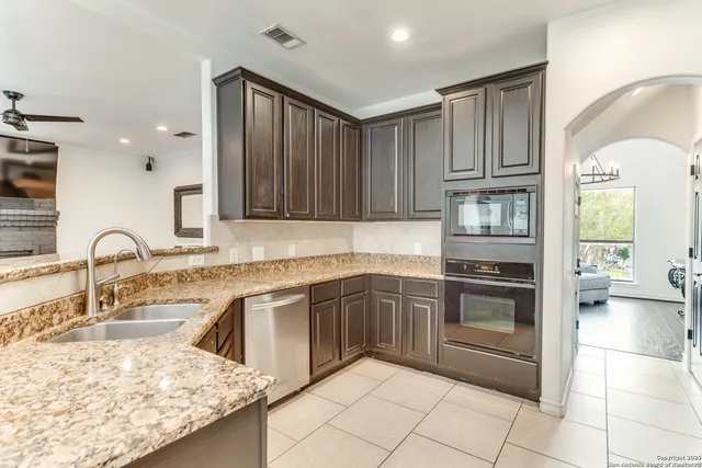 a kitchen with a sink and cabinets