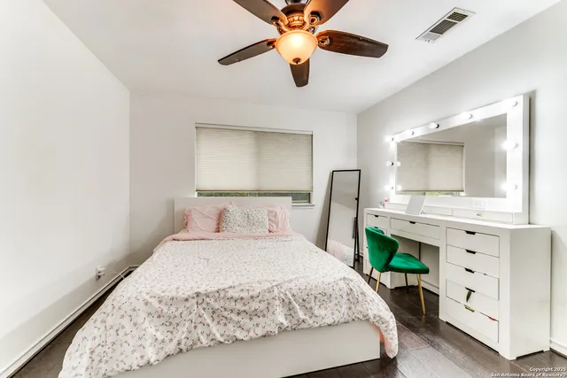 a en suite bathroom with a sink and mirror