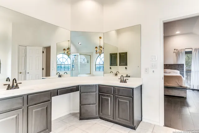 a spacious bathroom with a large tub and shower