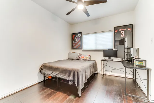 a view of swimming pool with a chairs in a patio