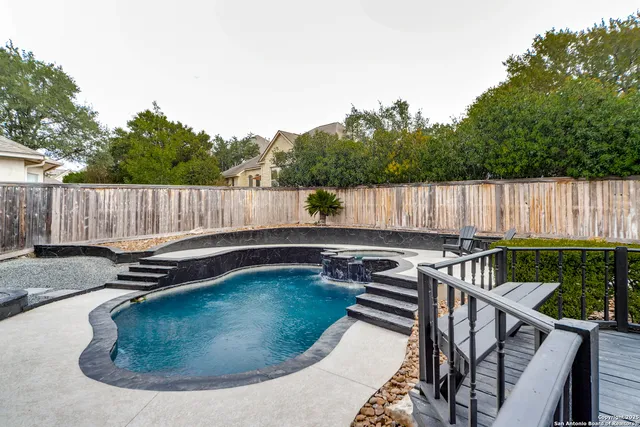a view of a swimming pool with a patio