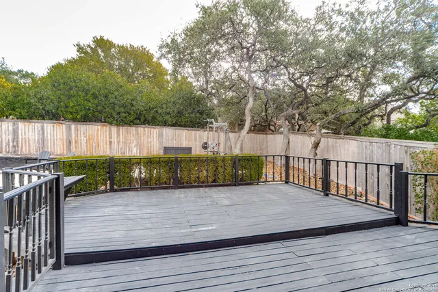 a view of a balcony with wooden floor
