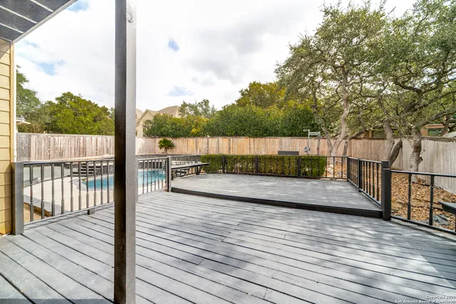 a view of a balcony with wooden floor