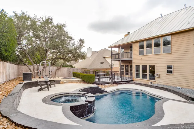 a view of a swimming pool with a lounge chairs
