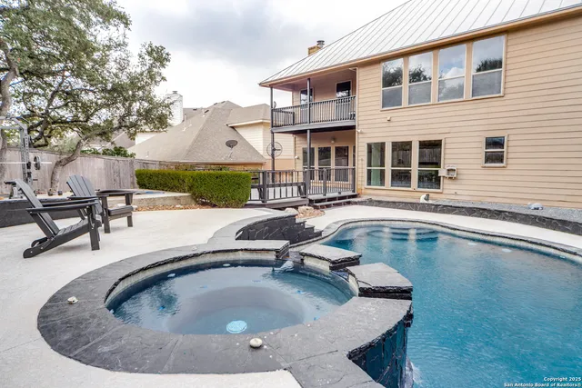 an aerial view of a house roof deck and outdoor seating