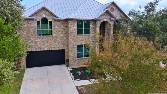 a front view of a house with yard