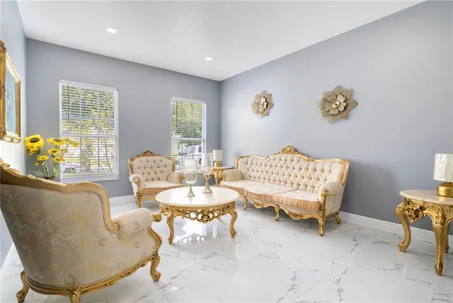 a living room with furniture and a table