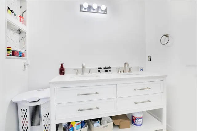 a bathroom with a sink and a mirror
