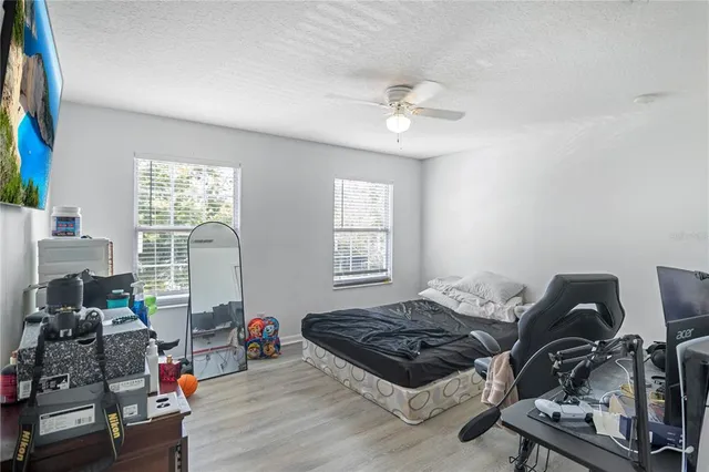 a bedroom with furniture and a window
