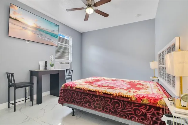 a bedroom with a bed and a table