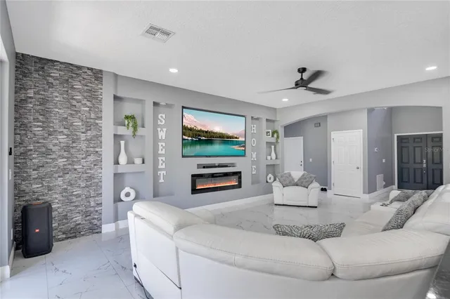a living room with furniture and a flat screen tv