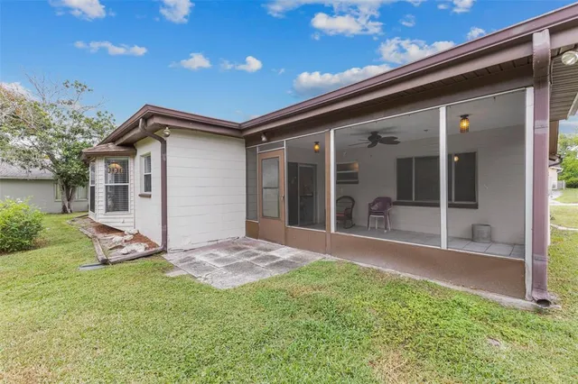 a view of a house with backyard porch and garden
