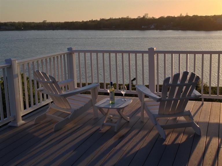 70 Gibson Road Orleans, MA 02653 - Photo 1 of 35 a view of a chairs and table on the terrace