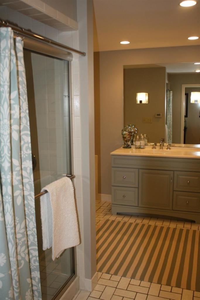 70 Gibson Road Orleans, MA 02653 - Photo 23 of 35 a bathroom with a sink a mirror and vanity