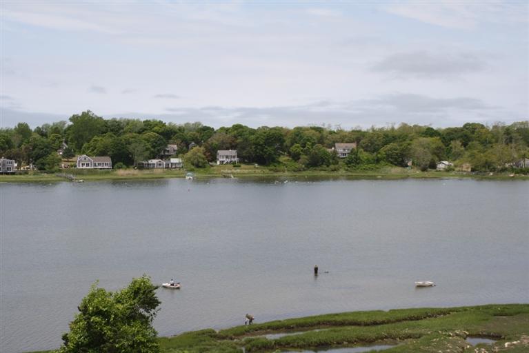 70 Gibson Road Orleans, MA 02653 - Photo 28 of 35 a view of a lake with houses in the back
