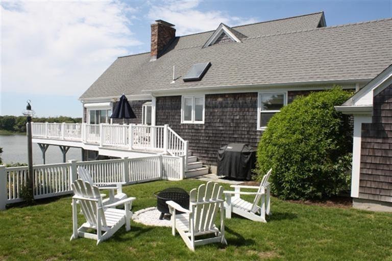 70 Gibson Road Orleans, MA 02653 - Photo 29 of 35 a front view of house with yard and outdoor seating