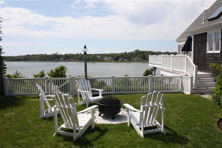 70 Gibson Road Orleans, MA 02653 - Photo 3 of 35 a view of a deck with two chairs and a table