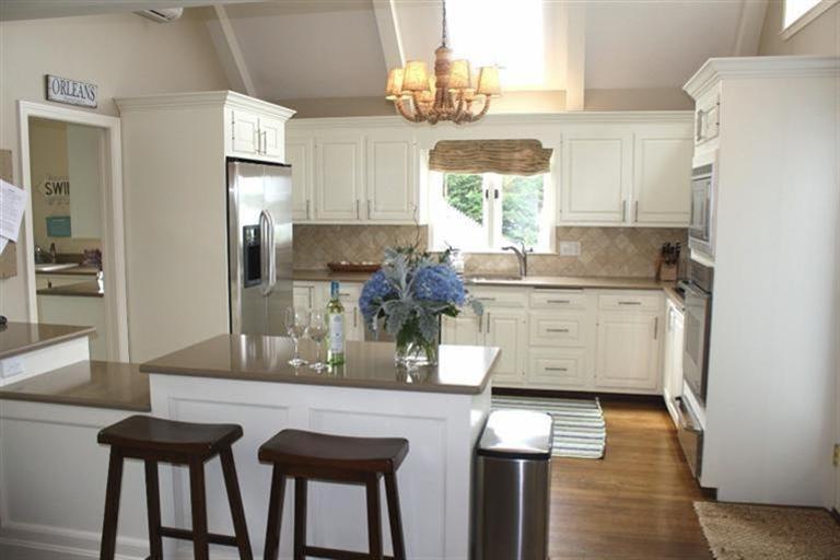 70 Gibson Road Orleans, MA 02653 - Photo 5 of 35 a kitchen with stainless steel appliances granite countertop a sink refrigerator and cabinets