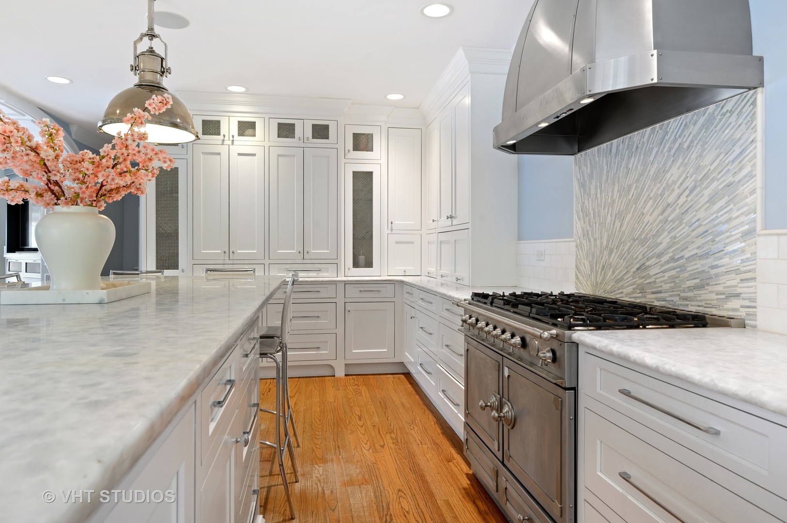 92 Robsart Road Kenilworth, IL 60043 - Photo 18 of 54 a kitchen with granite countertop a sink stove and cabinets
