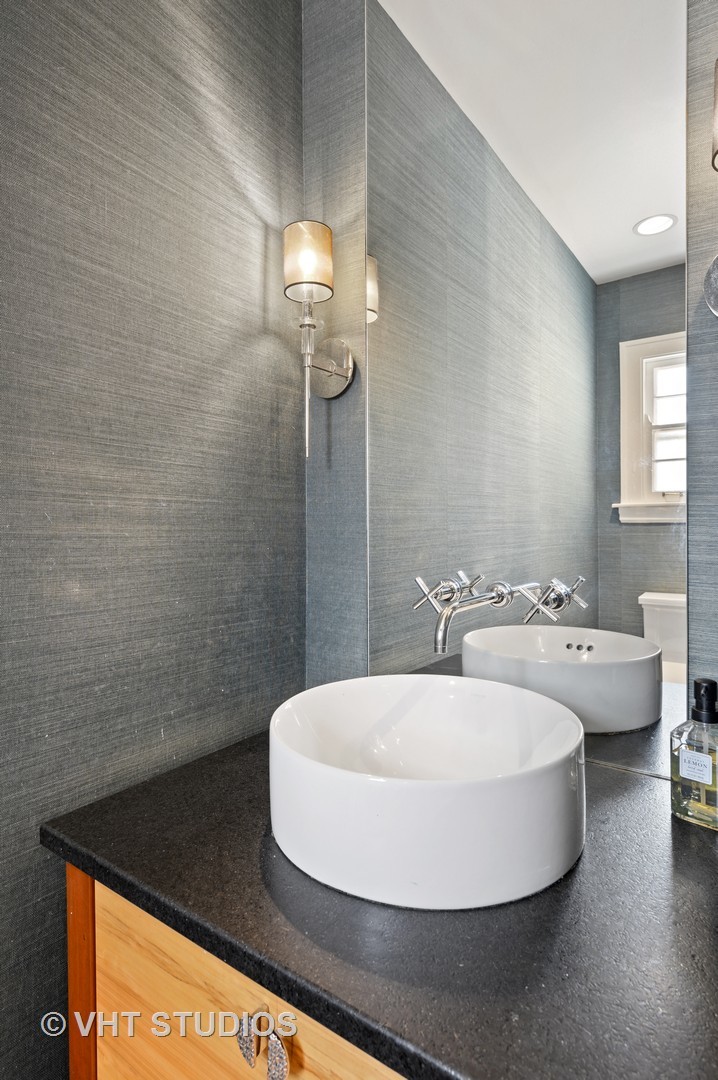 92 Robsart Road Kenilworth, IL 60043 - Photo 24 of 54 a bathroom with a sink and a mirror