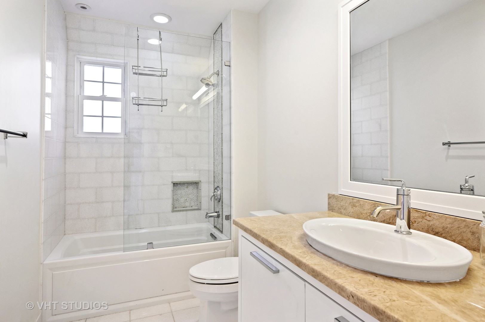 92 Robsart Road Kenilworth, IL 60043 - Photo 29 of 54 a bathroom with a granite countertop sink a toilet a mirror a bathtub and shower