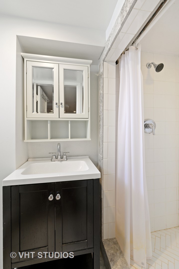 92 Robsart Road Kenilworth, IL 60043 - Photo 41 of 54 a bathroom with a sink and a mirror