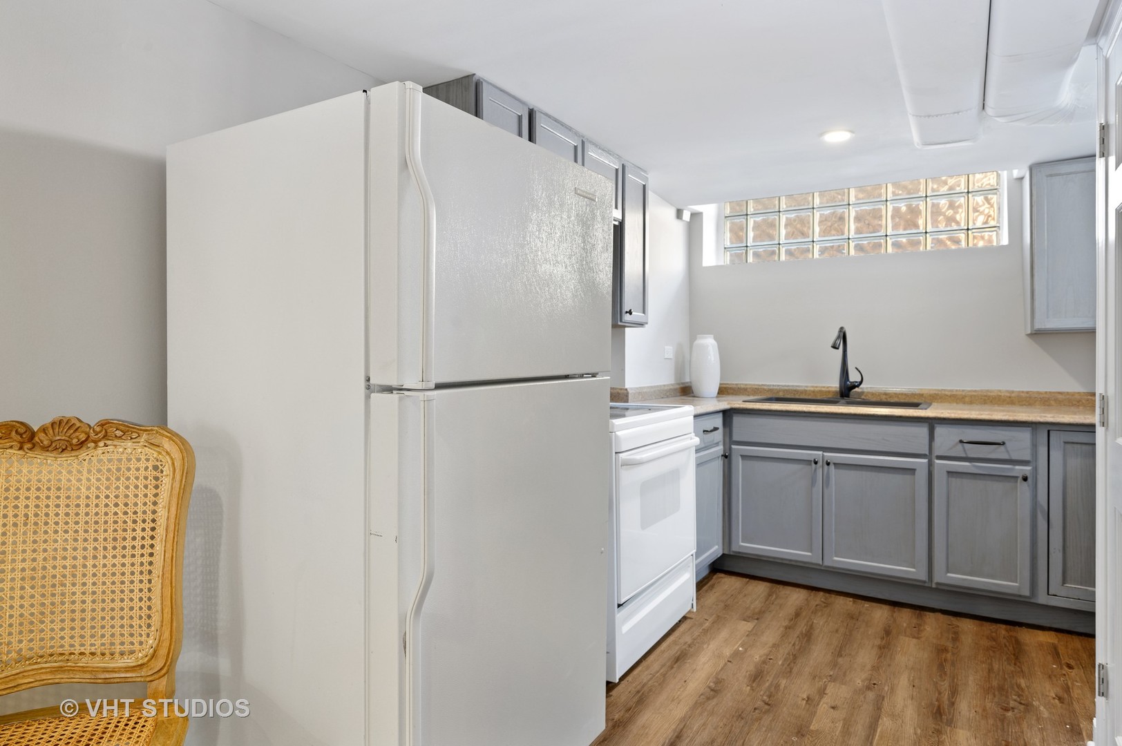 92 Robsart Road Kenilworth, IL 60043 - Photo 42 of 54 a kitchen with a refrigerator and a sink