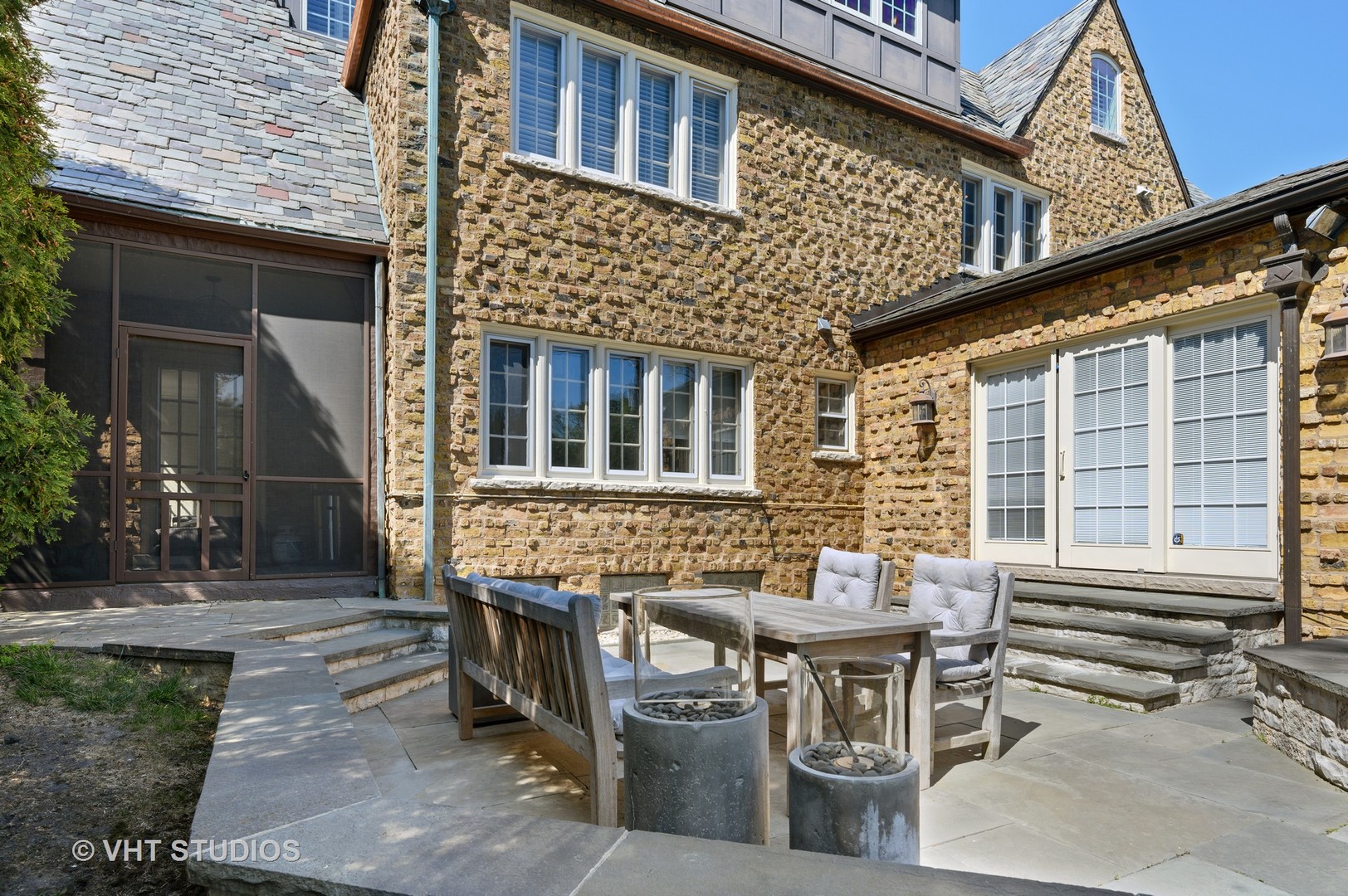 92 Robsart Road Kenilworth, IL 60043 - Photo 45 of 54 a front view of a house with a table and chairs
