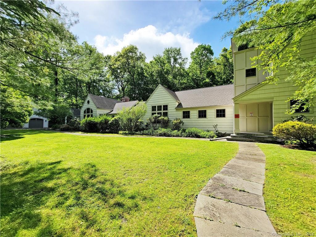 22 Ketcham Road Ridgefield, CT 06877 - Photo 3 of 40 a front view of house with yard and green space