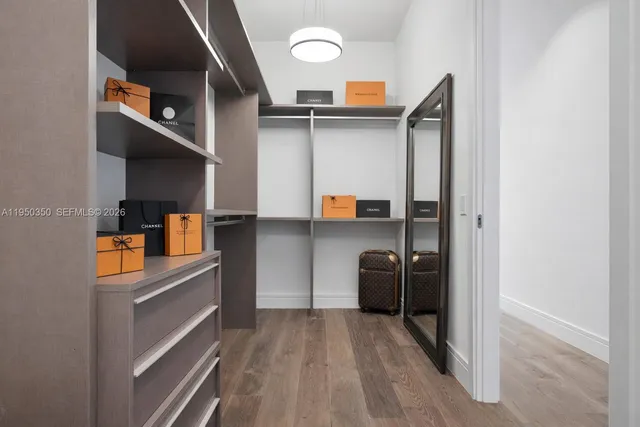 a white tub sitting next to a shower