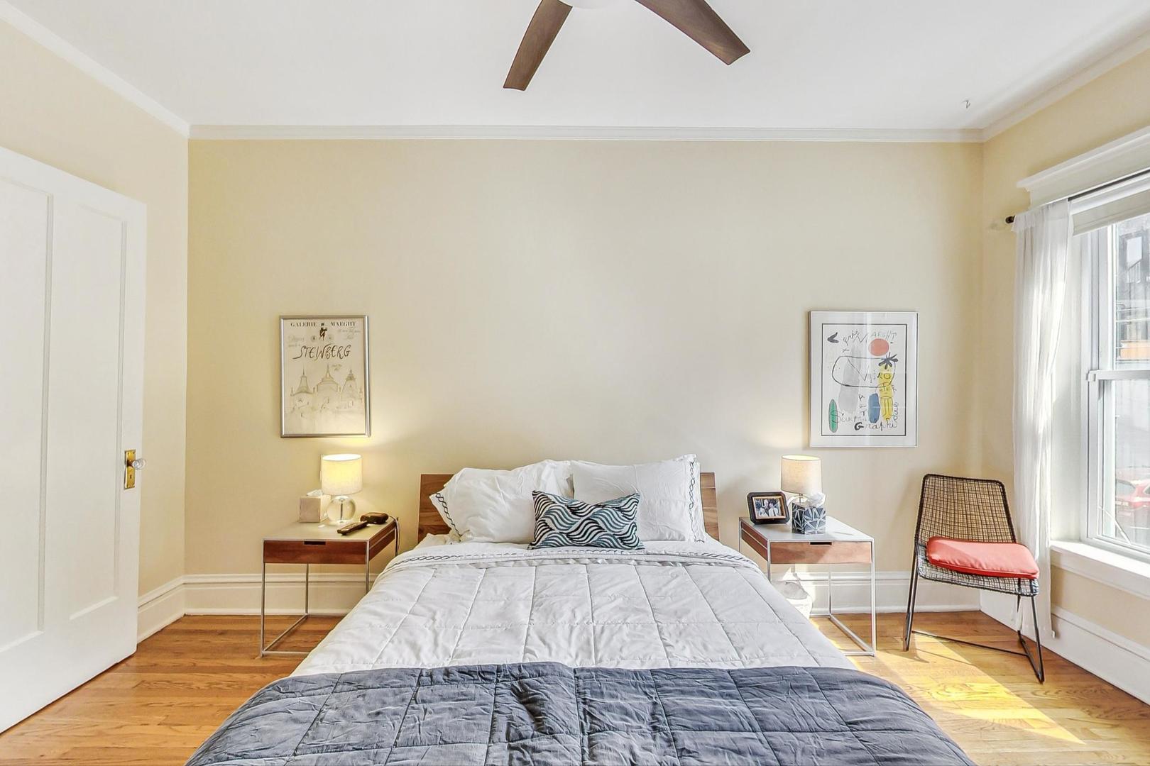 733 West Buckingham Place, Unit 13 Chicago, IL 60657 - Photo 14 of 28 a bedroom with a bed and wooden floor