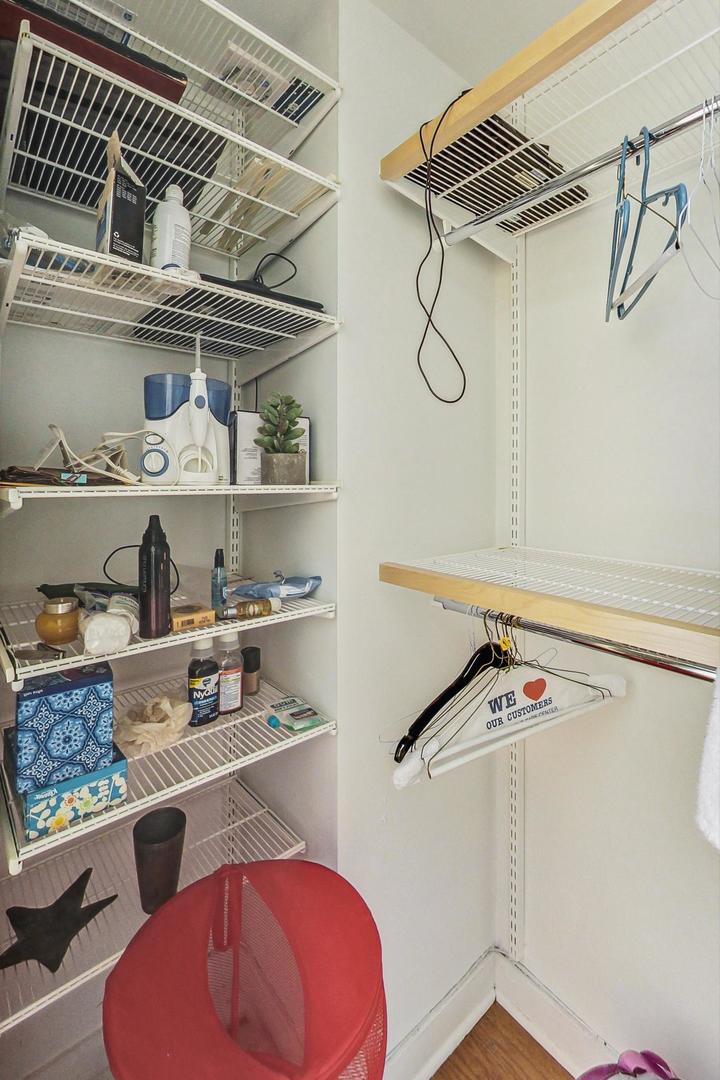733 West Buckingham Place, Unit 13 Chicago, IL 60657 - Photo 18 of 28 a kitchen with a refrigerator and cabinets