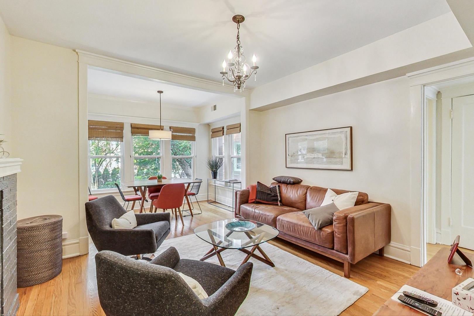 733 West Buckingham Place, Unit 13 Chicago, IL 60657 - Photo 4 of 28 a living room with furniture and a chandelier