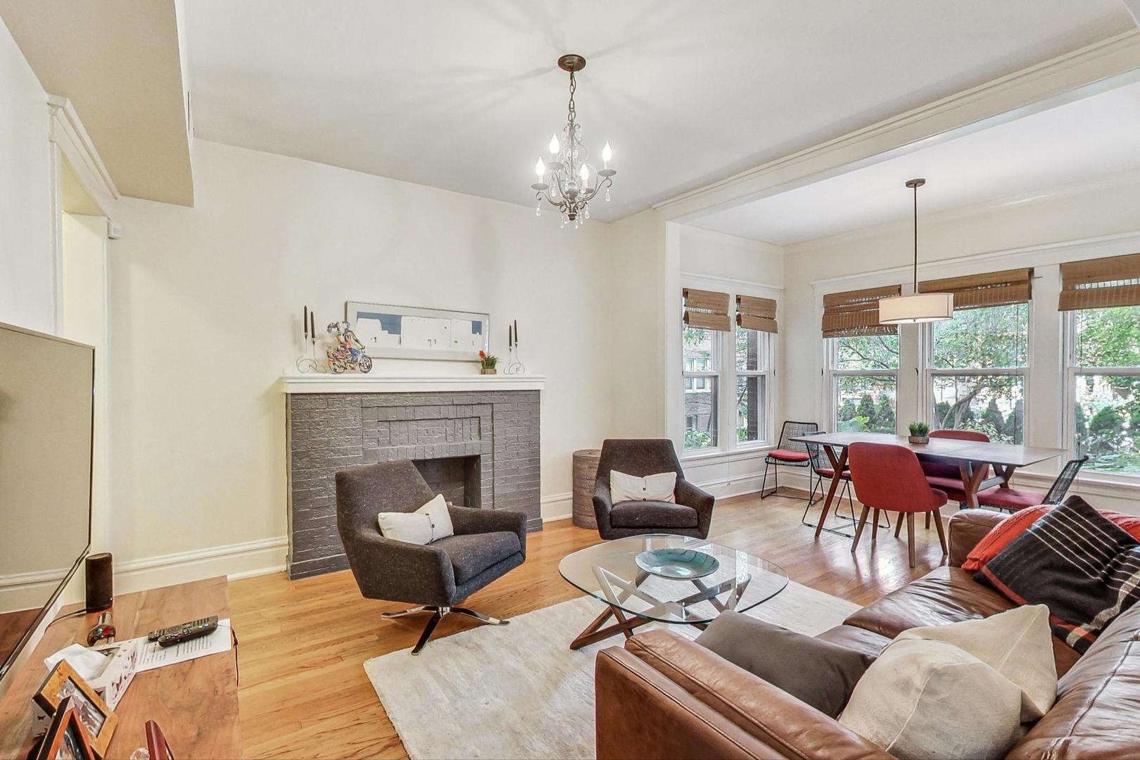 733 West Buckingham Place, Unit 13 Chicago, IL 60657 - Photo 6 of 28 a living room with furniture fireplace and window