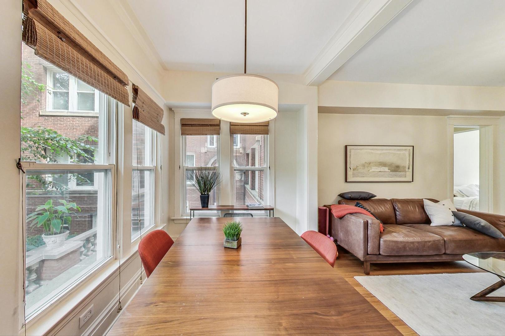 733 West Buckingham Place, Unit 13 Chicago, IL 60657 - Photo 8 of 28 a living room with furniture and a large window